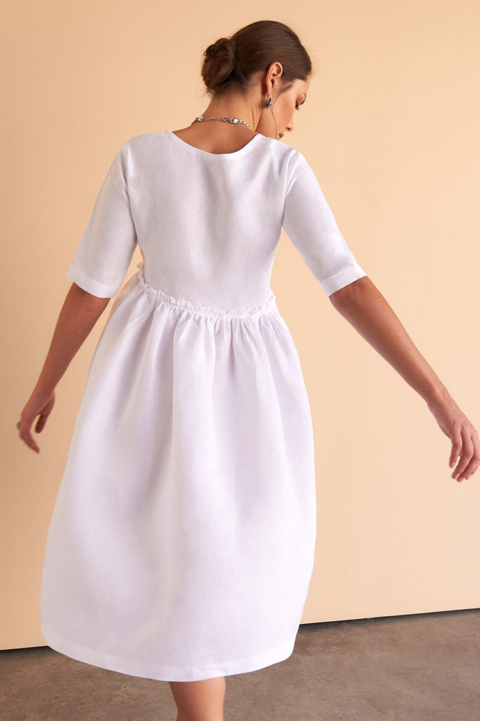 ladies white linen knee length dress with high waste line